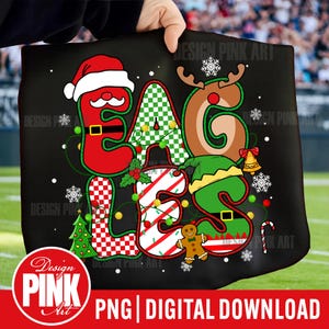 May include: Black tote bag with a Christmas-themed design. The word "EAGLES" is spelled out with letters decorated as Santa, a reindeer, and an elf. Includes snowflakes, a gingerbread man, and a candy cane. The text "PNG DIGITAL DOWNLOAD" is at the bottom.