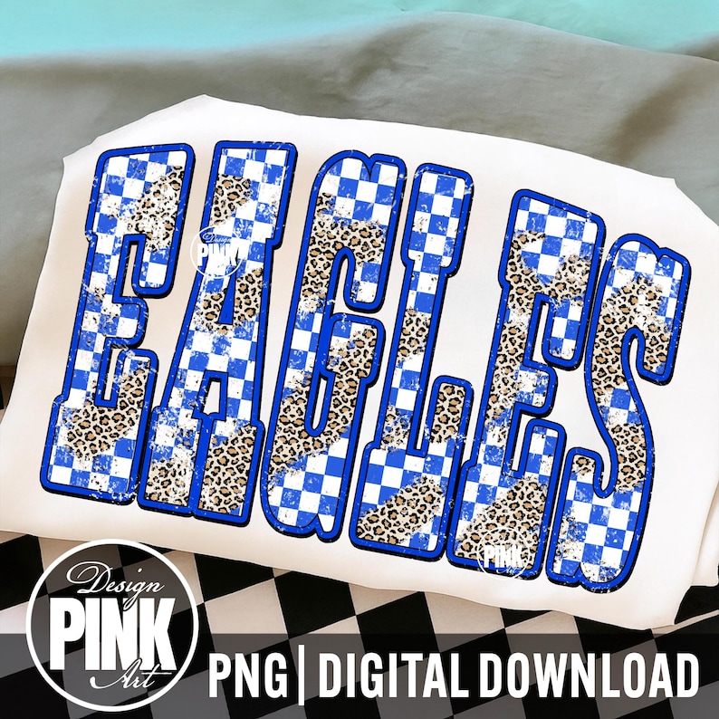 May include: White t-shirt with the word "EAGLES" in large, bold letters. The letters have a blue and white checkered pattern with a leopard print fill. The design includes the text "PNG | DIGITAL DOWNLOAD" and a logo.