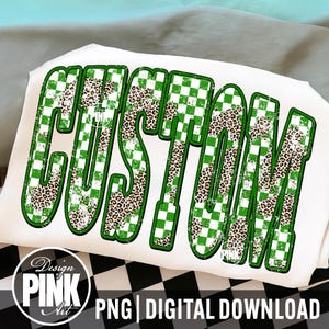 May include: White t-shirt with the word "CUSTOM" in large, bold letters. The letters have a green and white checkered pattern, with leopard print accents. The design includes the text "Design PINK Art" and "PNG | DIGITAL DOWNLOAD".