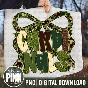 May include: A digital design featuring the word "CARDINALS" in a bold, layered font with green glitter and camouflage patterns. The design includes a bow and stars, with the text "PNG | DIGITAL DOWNLOAD" at the bottom.