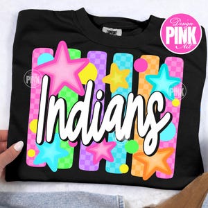 May include: Black sweatshirt with the word "Indians" in white script, decorated with colorful stars and vertical stripes in pink, green, orange, and purple. The design includes the text "Design PINK Art" in a pink circle.