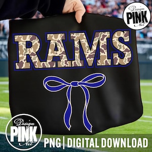 May include: Black tote bag featuring the word "RAMS" in camouflage print with a blue outline. A blue ribbon design is below the text. The bag has the text "PNG DIGITAL DOWNLOAD" at the bottom, with the "Design PINK Art" logo.