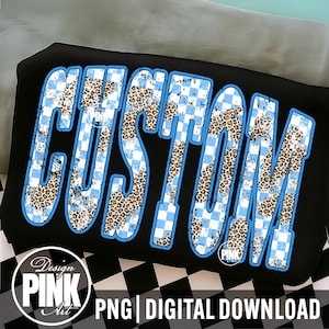 May include: Black graphic design featuring the word "CUSTOM" in a bold, outlined font. The letters are filled with a combination of light blue checkered patterns and leopard print. The design includes a "Design PINK Art" logo and the text "PNG | DIGITAL DOWNLOAD".