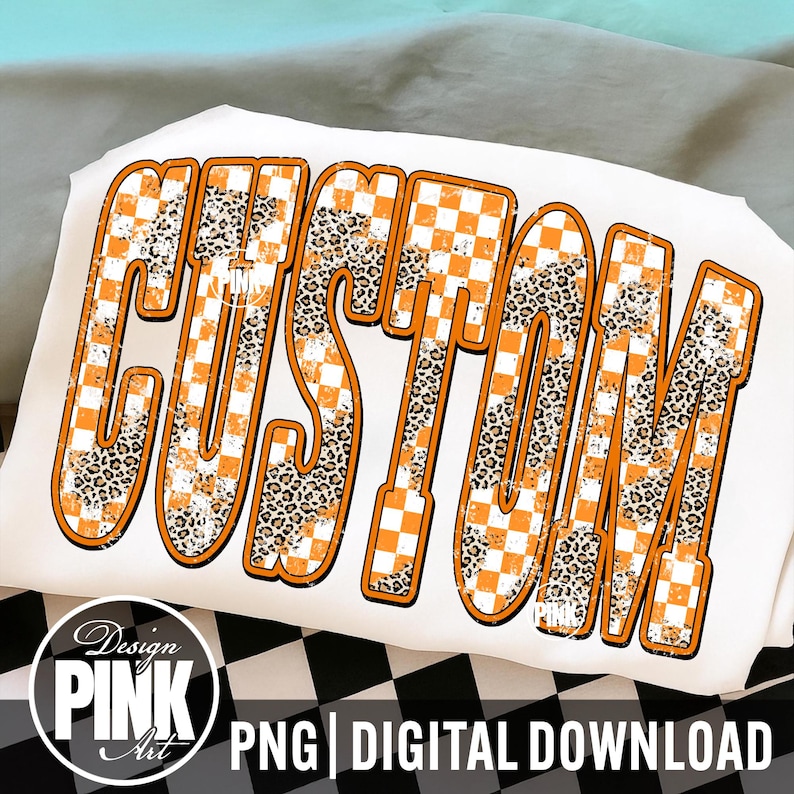 May include: White t-shirt with the word "CUSTOM" in large, orange, and leopard print letters. The letters have a distressed checkerboard pattern. The design includes the text "PNG | DIGITAL DOWNLOAD" and a logo that says "Design PINK Art".