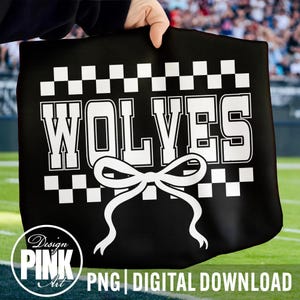 May include: Black tote bag with the word "WOLVES" in large white block letters, a white bow, and a checkered pattern. The words "PNG DIGITAL DOWNLOAD" are at the bottom. The bag is held up by a hand.