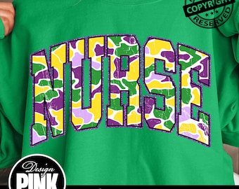 May include: Green sweatshirt with the word "NURSE" in large, distressed, block letters. The letters are filled with a camouflage pattern in yellow, purple, and green. The design includes a "Design Pink Art" logo and the text "PNG | DIGITAL DOWNLOAD".