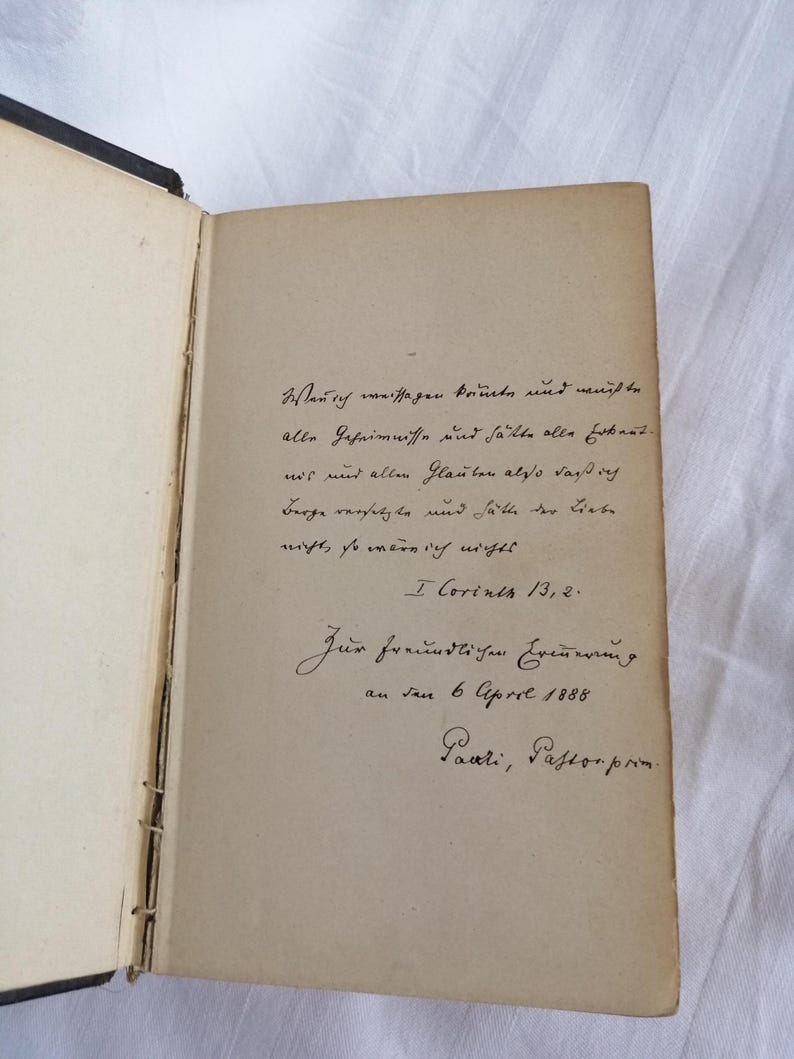 May include: Open book with handwritten text in German. The text is in black ink on aged, cream-colored paper. The book's spine is visible, showing the binding. The text includes a date of April 6, 1888.