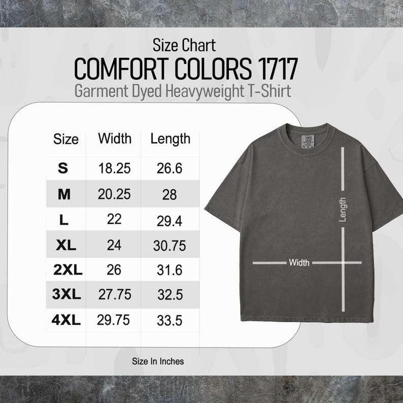 Puede incluir: Una camiseta gris oscuro Comfort Colors 1717 de peso pesado con una tabla de tallas. La tabla muestra medidas en pulgadas para las tallas S a 4XL. El ancho de la camiseta var&iacute;a de 46,35 cm a 75,57 cm, y el largo de 67,56 cm a 85,09 cm.