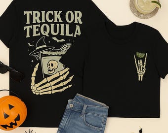 May include: Black t-shirts with Halloween designs. One shirt displays "TRICK OR TEQUILA" with a skeleton hand holding a cocktail. The other has a skeleton hand with a lime slice, perfect for spooky season.