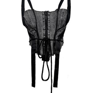 May include: A gray denim corset top with black straps and a front zipper. The corset features black ribbon detailing and a lace-up back. The top is designed with a structured silhouette.
