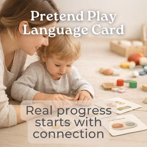 May include: A mother and child are looking at language cards on the floor. The cards have illustrations of everyday objects. The text on the cards reads "Mini Lessons". The image also includes the text "Pretend Play Language Card" and "Real progress starts with connection."