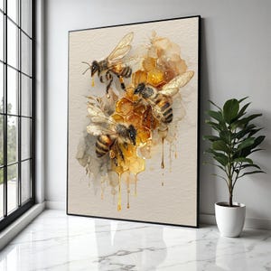 May include: A framed watercolour painting depicting honeybees and a honeycomb. The image shows three bees with detailed wings and striped bodies, near a golden honeycomb with dripping honey. The background has soft watercolour washes in beige and brown.