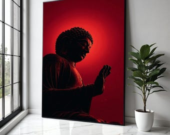 May include: A framed print of a Buddha statue in a meditative pose. The artwork features a dark red color palette with the Buddha's silhouette in a darker shade against a vibrant red background. The image is displayed in a well-lit corner with a plant.
