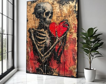 Pode incluir: Obra de arte emoldurada com uma figura esquelética segurando um coração vermelho. A obra tem um fundo texturizado com tons de ouro, preto e vermelho. O esqueleto é preto e o coração é vermelho vibrante. A peça é exibida em um ambiente moderno.