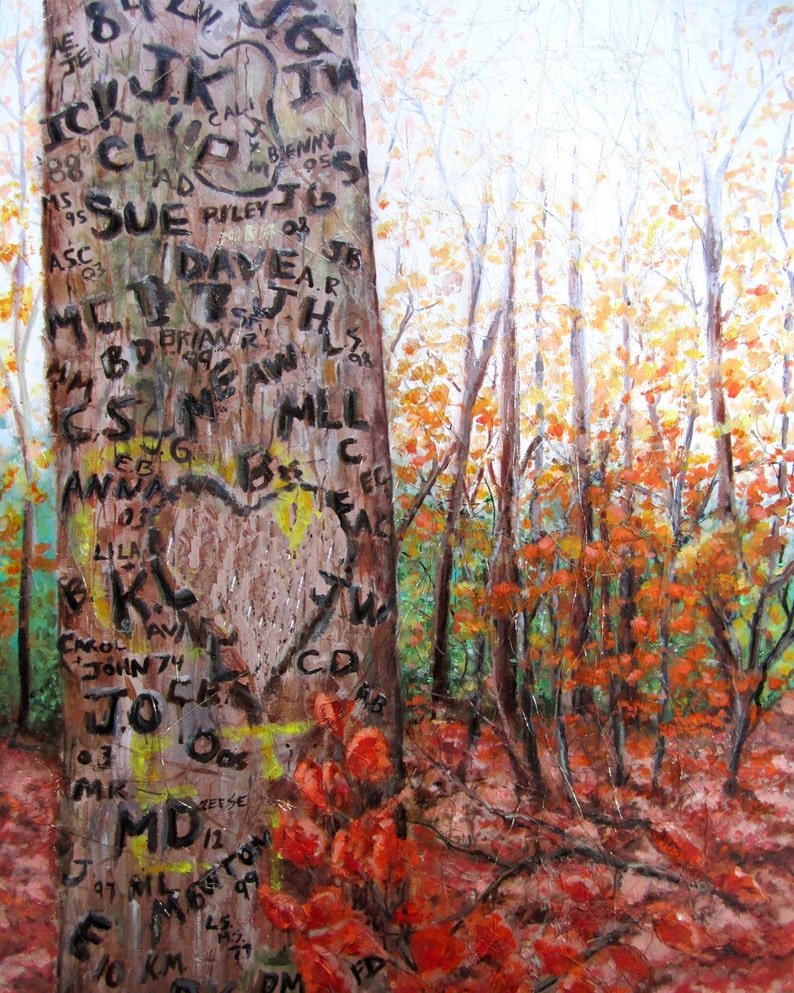 May include: A close-up of a tree trunk in a forest with carved initials and dates. The tree trunk is brown and has a heart carved into it. The forest is in the background and the leaves are turning red and orange.