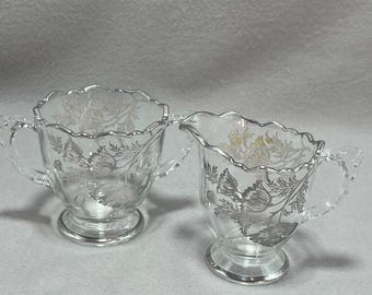 Juego de cremera y azucarero vintage de cristal transparente con revestimiento de plata Silver City Poppy Flanders