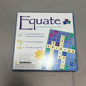 May include: A square board game box titled Equate: The Equation Thinking Game. The white box features a grid game board with numbers and mathematical symbols, along with text describing the game for 2 to 4 players, ages 8 and up, and a warning.