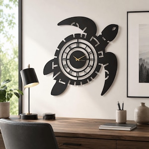 May include: A black wall clock shaped like a sea turtle with a circular center featuring Roman numerals and thin gold hands. The clock has a cutout design that forms the shell and flippers of the turtle, creating a distinct silhouette on the wall.
