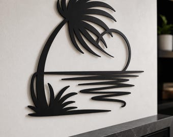 May include: A black metal wall art piece featuring a stylized silhouette of a palm tree leaning over a horizon line with wavy lines representing water below. The design incorporates a curved shape that connects the tree top to the horizon line.