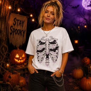 Cute Halloween Bat Skeleton Shirt, Spooky Rib Cage T-Shirt, Gothic Ghost Season Tee, Purple Halloween Graphic Shirt, Fall Aesthetic Gift
