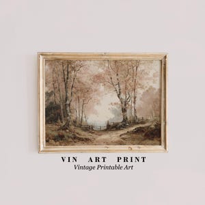 Op de afbeelding: Vintage kunstafdruk in een gouden lijst. De afbeelding toont een boslandschap met een pad dat door bomen met roze en bruine bladeren loopt. De tekst "VIN ART PRINT Vintage Printable Art" staat onderaan.