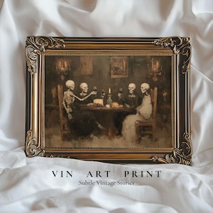 May include: A rectangular art print in an ornate, dark brown and gold frame. The print depicts four skeletons seated at a table, holding wine glasses in a dimly lit room with a single candle. The text VIN ART PRINT Subtle Vintage Stories is below.
