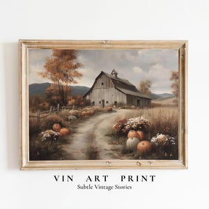 May include: A framed landscape print featuring a weathered wooden barn situated at the end of a dirt path. The scene includes orange pumpkins scattered in the foreground, autumn-colored trees, and rolling hills under a cloudy sky. Text reads VIN ART PRINT Subtle Vintage Stories.