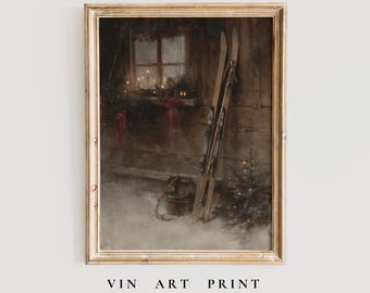 May include: Vintage art print featuring a winter scene with skis leaning against a wooden wall. A small Christmas tree and a bucket sit in the snow. The print has a gold frame and the text "VIN ART PRINT" and "Subtle Vintage Stories".