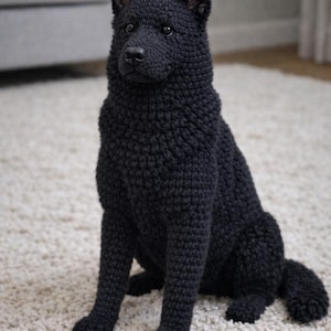 May include: A black crochet dog, meticulously crafted with textured yarn, sits on a cream carpet. The dog has pointed ears and a fluffy tail, giving it a lifelike appearance. The handmade figurine is a charming decorative item.