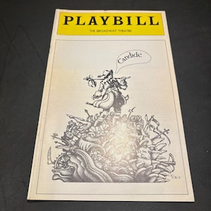 May include: Playbill cover for the Broadway production of "Candide." The cover features a yellow banner with the title "PLAYBILL" and the text "THE BROADWAY THEATRE." An illustration of a figure with a walking stick and a speech bubble that says "Candide."