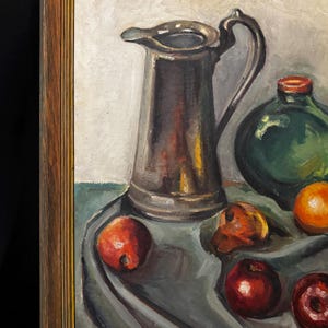 May include: Oil painting of a still life featuring a silver pitcher, a green bottle, and several pieces of fruit. The fruit includes red apples and oranges. The painting is set against a gray tablecloth.