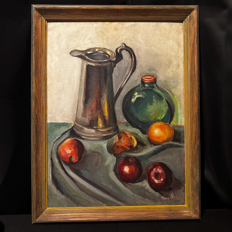May include: Oil painting of a still life with a silver pitcher, a green bottle, and several pieces of fruit. The painting is in a wooden frame. The fruit includes oranges and red apples. The background is a light color.