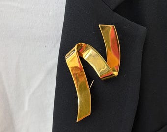 Broche vintage de cinta dorada de Monet firmado