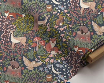 May include: A patterned fabric depicting a forest scene with deer, foxes, owls, raccoons, mushrooms, and a crescent moon on a dark blue backdrop. The design incorporates pink flowers, butterflies, and stars, creating a charming woodland theme.