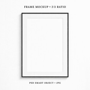 May include: A black framed rectangular mockup with a white interior. The text at the top reads "FRAME MOCKUP • 2:3 RATIO". The text at the bottom reads "PSD SMART OBJECT • JPG". The frame is centered on a white background.