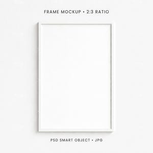 May include: A white rectangular frame mockup with a 2:3 ratio, set against a plain white background. The frame is empty, with the text "FRAME MOCKUP • 2:3 RATIO" at the top and "PSD SMART OBJECT • JPG" at the bottom.