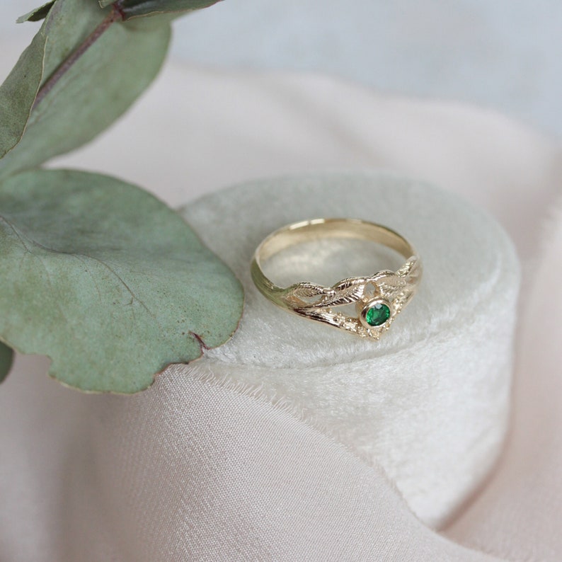 gold leaf ring with green emerald