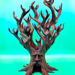 May include: A brown, three-dimensional tree sculpture featuring a detailed face integrated into the trunk. The tree has a wide, textured base with roots and numerous upward-reaching, branch-like structures that extend outward in a complex pattern.