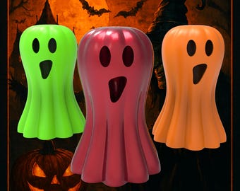 Może przedstawiać: Obraz o tematyce Halloween z trzema figurkami w kształcie ducha w kolorze zielonym, czerwonym i pomarańczowym. Figurki mają wycięte oczy i usta. Tło przedstawia pełnię księżyca, nietoperze oraz pomarańczowe napisy "HALLOWEEN" i "TREATY 31ST".