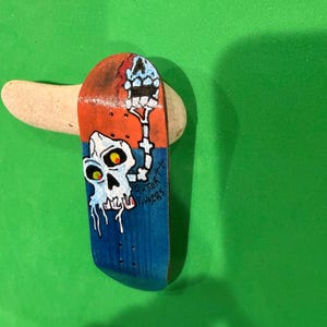 May include: A set of three ceramic mugs with a speckled, matte finish. The mugs are in shades of cream, light gray, and dark gray. Each mug has a simple, minimalist design, perfect for coffee or tea.