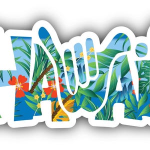 May include: White sticker with the word "HAWAII" in a stylized font. The letters are filled with a tropical scene of green leaves, red flowers, and a blue sky. The sticker has a white border and a slight shadow.