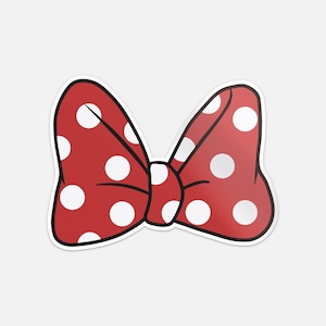 May include: A red bow with white polka dots and a black outline. The bow is tied in the center and has two loops on each side. This classic design is a popular accessory.