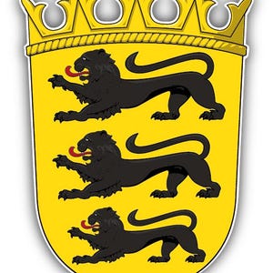 May include: A sticker featuring the coat of arms of Baden-Württemberg. The shield is yellow with three black lions, each with a red tongue. A gold crown sits atop the shield.
