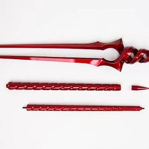May include: A disassembled, glossy red fantasy weapon, possibly a spear or staff, against a white background. The weapon features a spiraled handle and two long, pointed blades. Additional components include a smaller spiraled section and a conical tip.