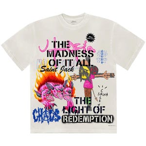 May include: Off-white t-shirt with a graphic design featuring the text "THE MADNESS OF IT ALL Saint Jack" in pink and black. The design includes a three-headed pink monster engulfed in flames, and a figure on a cross. The word "CHAOS" is also visible.