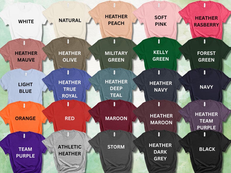 May include: A collection of t-shirts in various colors, each labeled with its color name in white text. Colors include white, natural, peach, pink, and raspberry, among others. The shirts are arranged in rows, showcasing a wide range of options.
