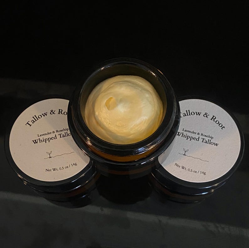 May include: Three small, dark glass jars with white labels and a creamy, whipped product inside. The labels read "Tallow & Root" and "Lavender & Rosehip Whipped Tallow." Each jar contains 0.5 oz / 14g of product.