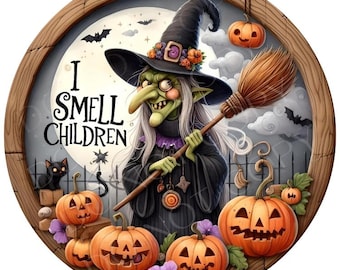 May include: A round wooden-framed sign featuring a green-skinned witch in a black hat holding a broomstick. The text reads I SMELL CHILDREN. The scene includes a full moon, a black cat, several carved jack-o'-lanterns, bats, and purple flowers.