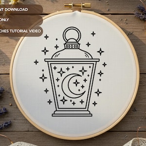 May include: An embroidery hoop with a white fabric featuring a black line drawing of a lantern, a crescent moon, and stars. The text "PDF INSTANT DOWNLOAD", "OUTLINES ONLY", and "BASIC STITCHES TUTORIAL VIDEO" is visible.