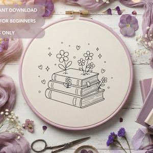 May include: An embroidery hoop with a floral book design. The design features a stack of books with flowers growing out of them, outlined in black. The text "PDF INSTANT DOWNLOAD", "OUTLINES ONLY", and "PERFECT FOR BEGINNERS" is also visible.